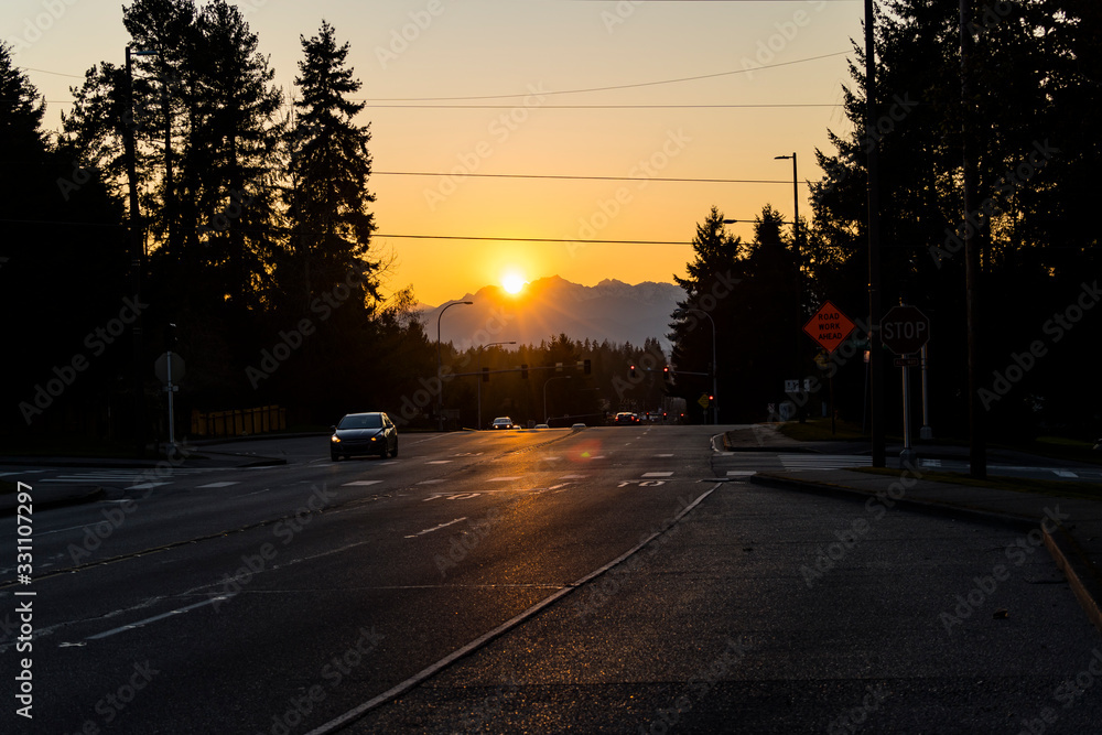 Sunset over road and Olympic Mountains