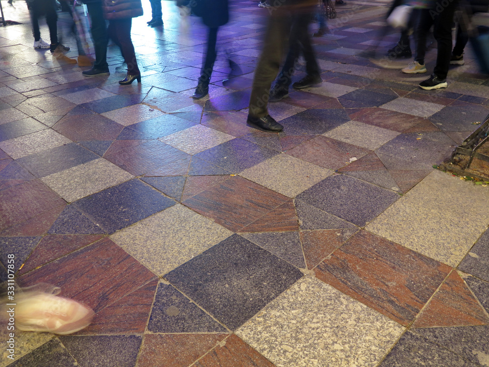 people walking on a pedestrian street at night people walking on a pedestrian street at night