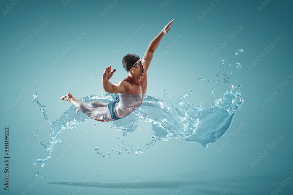 Professional man swimmer on a wave