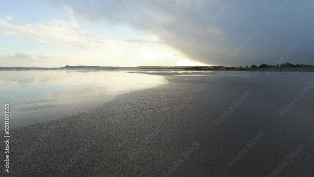 Wide angle at South Ireland beach in the evening at low tide, nobody Wide angle at South Ireland beach in the evening at low tide, nobody