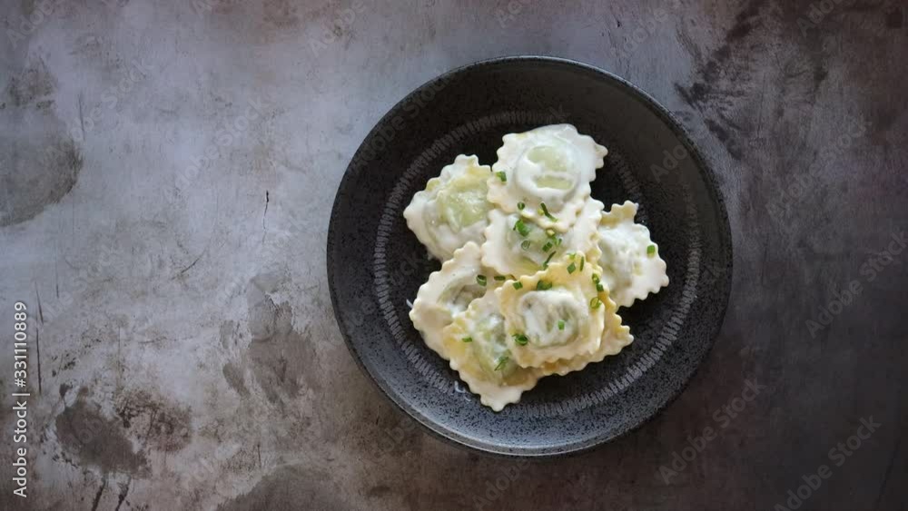 Serving a Bowl of Cheese and Spinach Ravioli with an Alfredo Sauce