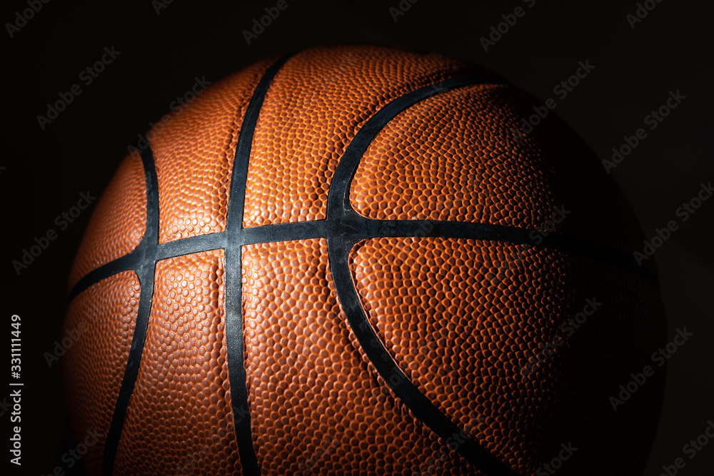 Fototapeta premium A close-up of a leather basketball on white