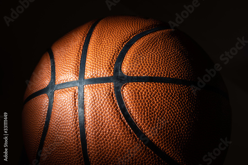 A close-up of a leather basketball on white © Michael Flippo