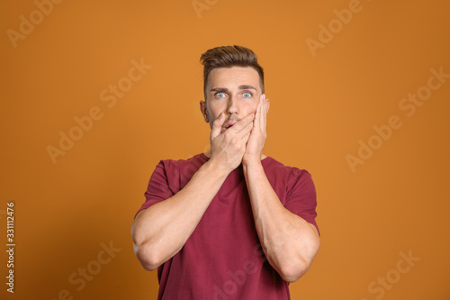 Worried man on color backgr...