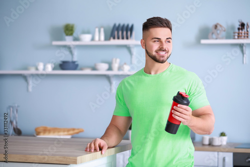 Sporty man with protein sha...