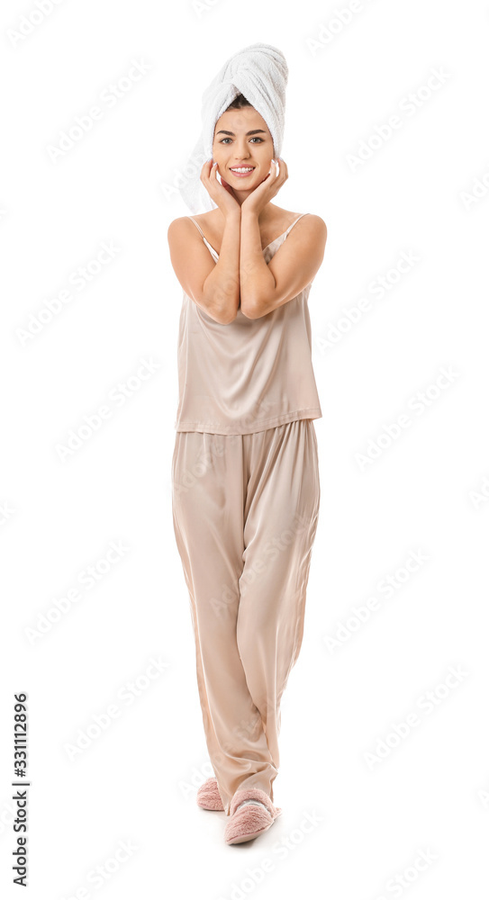 Portrait of woman in pajamas and with towel on white background Portrait of woman in pajamas and with towel on white background