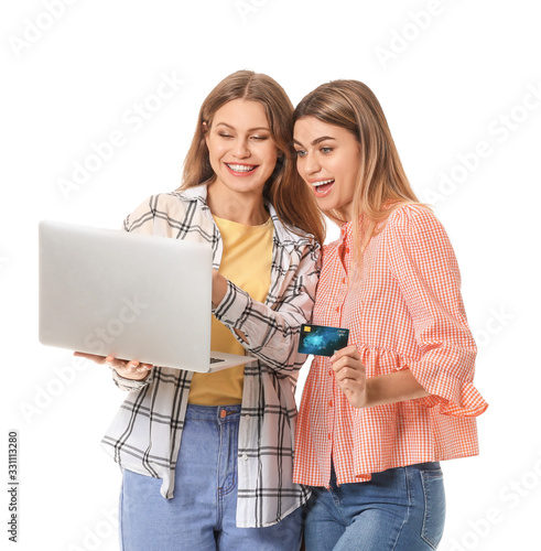 Young women with laptop and...