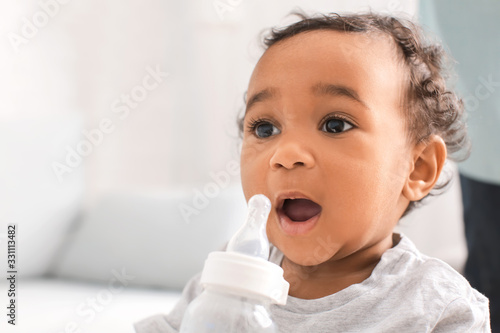 Wallpaper Mural African-American baby with bottle of water at home Torontodigital.ca