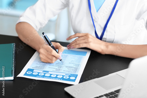 Young female doctor working...