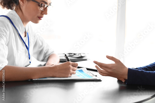 Patient visiting doctor in ...