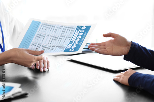 Patient visiting doctor in ...