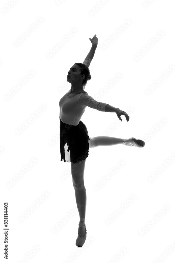 Silhouette of beautiful young ballerina on white background