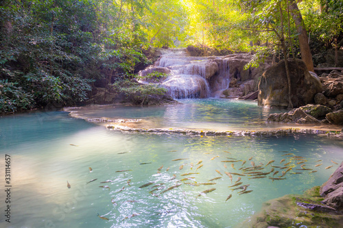 Landscape of Erawan waterfall in national park Is a waterfall in the deep forest with antimony fish at Kanchanaburi  Thailand.