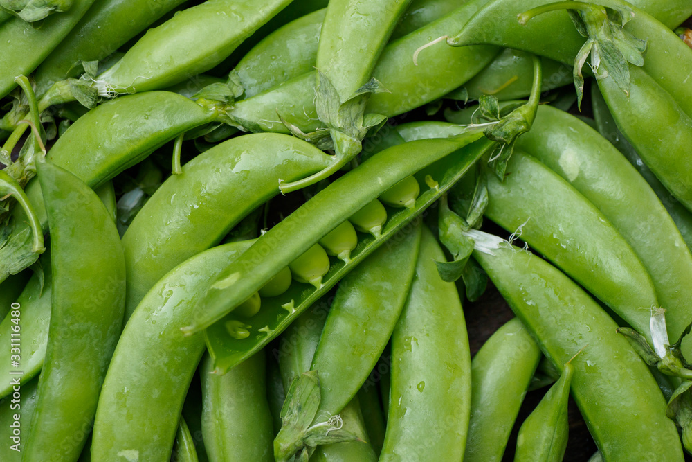 Peas pods on old wooden tables Peas pods on old wooden tables