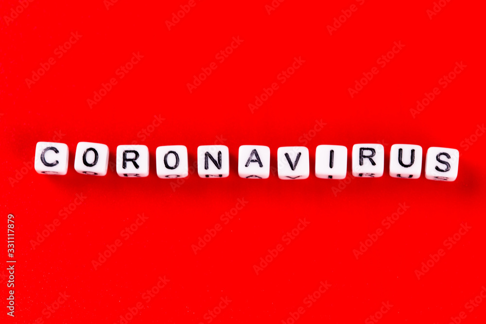 Pandemic and virus concept - Coronavirus word made of white blocks. Coronavirus text on red background. Pandemic and virus concept - Coronavirus word made of white blocks. Coronavirus text on red background.