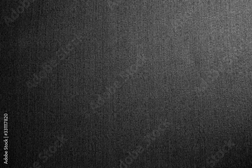 Black fabric texture background. Detail of canvas textile material.