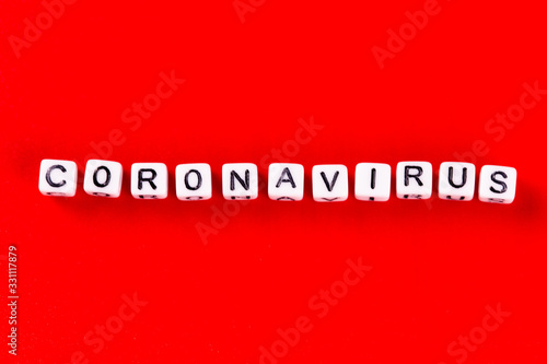 Pandemic and virus concept - Coronavirus word made of white blocks. Coronavirus text on red background.