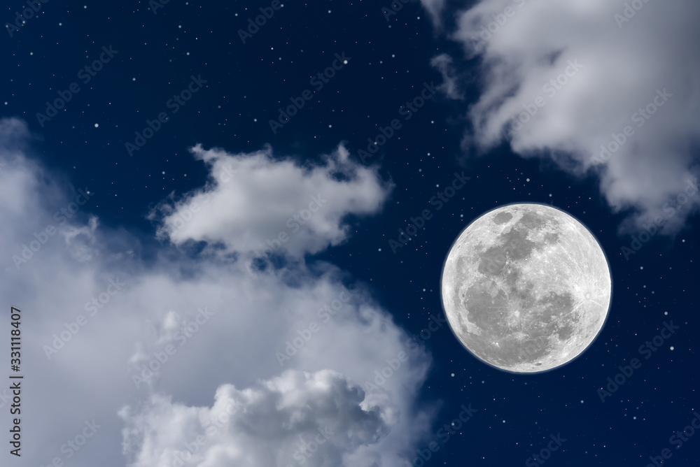 Full moon on blue sky between blurred white cloud. Full moon on blue sky between blurred white cloud.