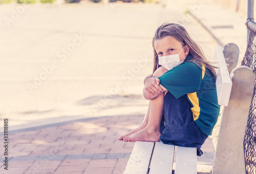 Schools closures Coronavirus lockdown. Bored and sad schoolgirl feeling depressed and lonely