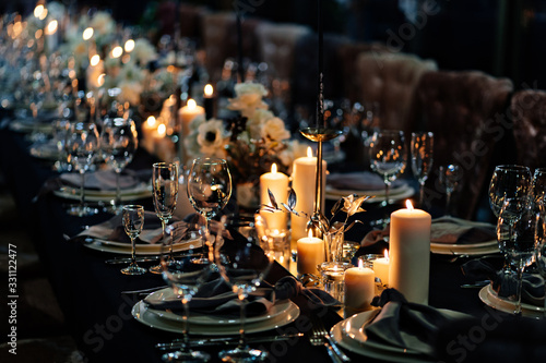 Vászonkép festive table setting candles for wedding party