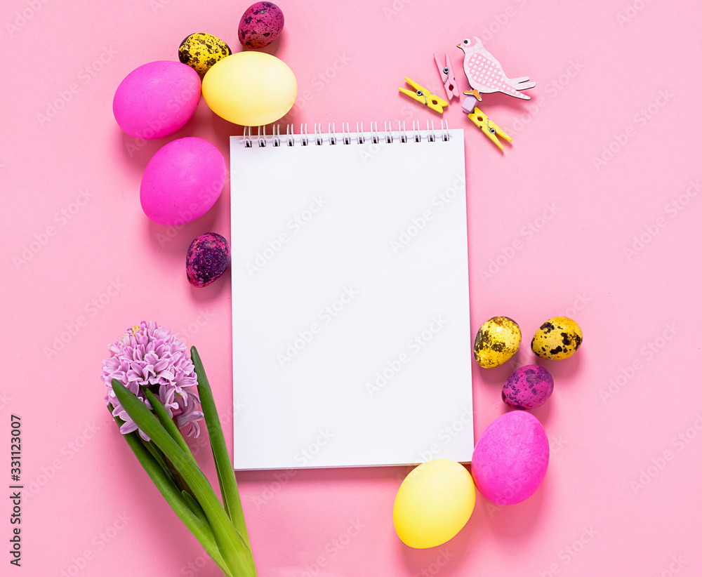 Happy easter concept. Festive spring layout of eggs clean notebook flowers on a pink background. Copy space. Happy easter concept. Festive spring layout of eggs clean notebook flowers on a pink background. Copy space.