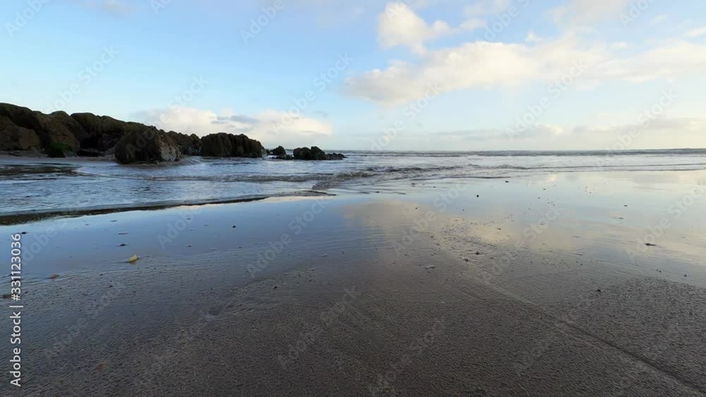Beautiful South Ireland sandy beach during low tide on bright day Beautiful South Ireland sandy beach during low tide on bright day
