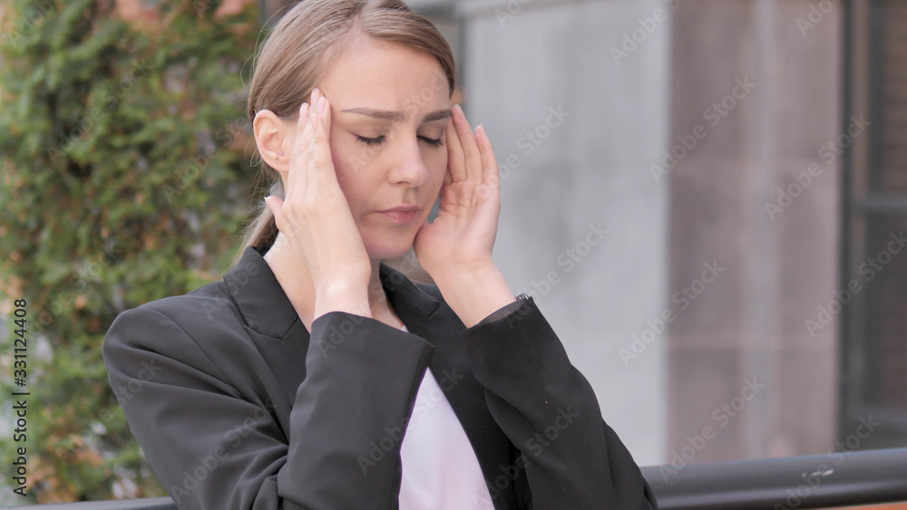 Stressed Young Businesswoman with Headache Sitting Outdoor Stressed Young Businesswoman with Headache Sitting Outdoor