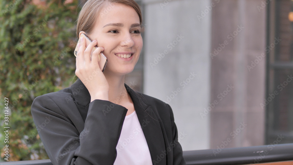 Young Businesswoman Talking on Phone Sitting Outdoor Young Businesswoman Talking on Phone Sitting Outdoor