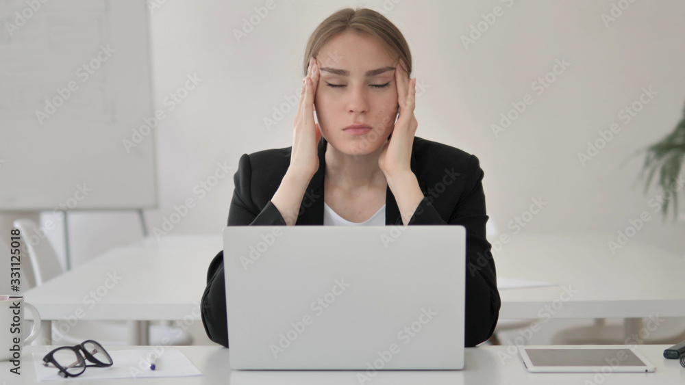 Stressed Young Businesswoman with Headache Working on Laptop Stressed Young Businesswoman with Headache Working on Laptop