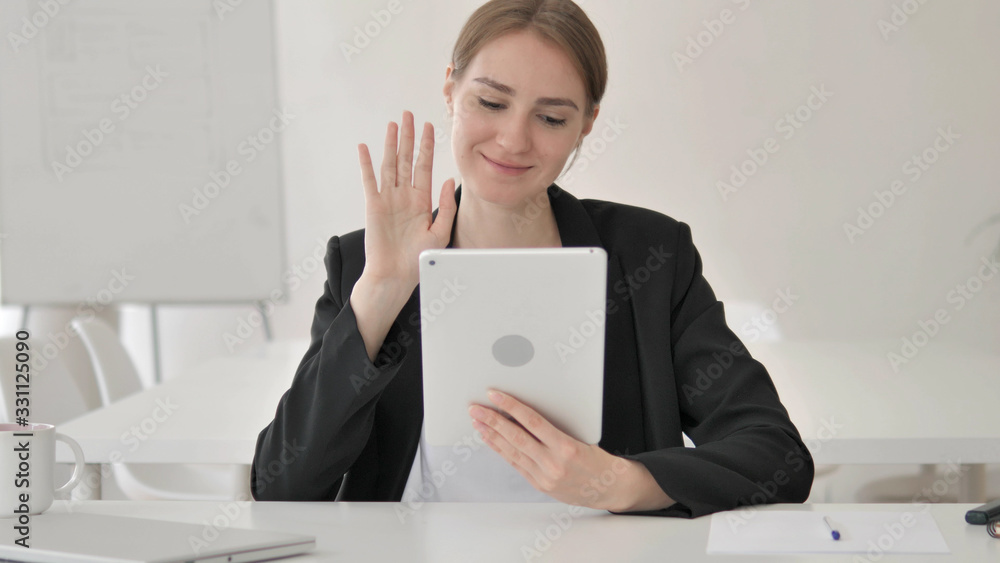 Online Video Chat on Tablet by Young Businesswoman Online Video Chat on Tablet by Young Businesswoman