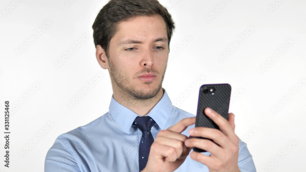 Young Businessman Using Smartphone on White Background Young Businessman Using Smartphone on White Background
