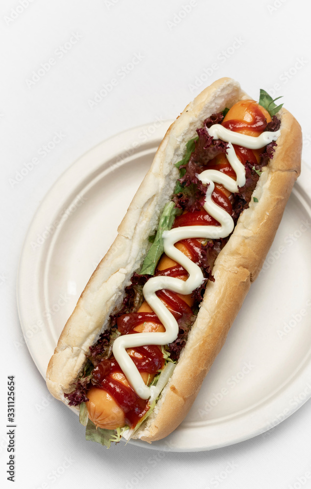 classic hot dog with frankfurter sausage and sauces classic hot dog with frankfurter sausage and sauces