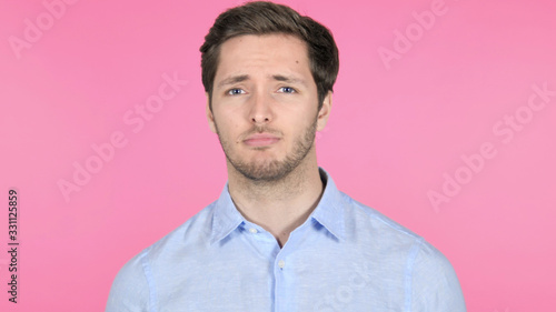 No, Disliking Young Man on Pink Background