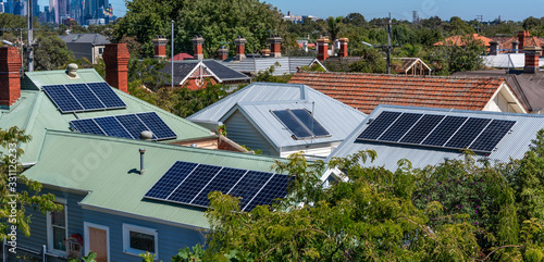 Solar panels on suburban house roofs in Melbourne, Australia