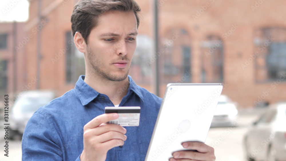 Outdoor Portrait of Young Man Shopping Online on Tablet Outdoor Portrait of Young Man Shopping Online on Tablet