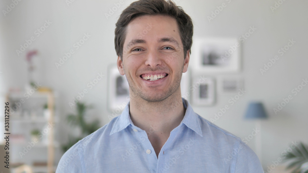 Portrait of Smiling Handsome Young Man Looking at Camera Portrait of Smiling Handsome Young Man Looking at Camera
