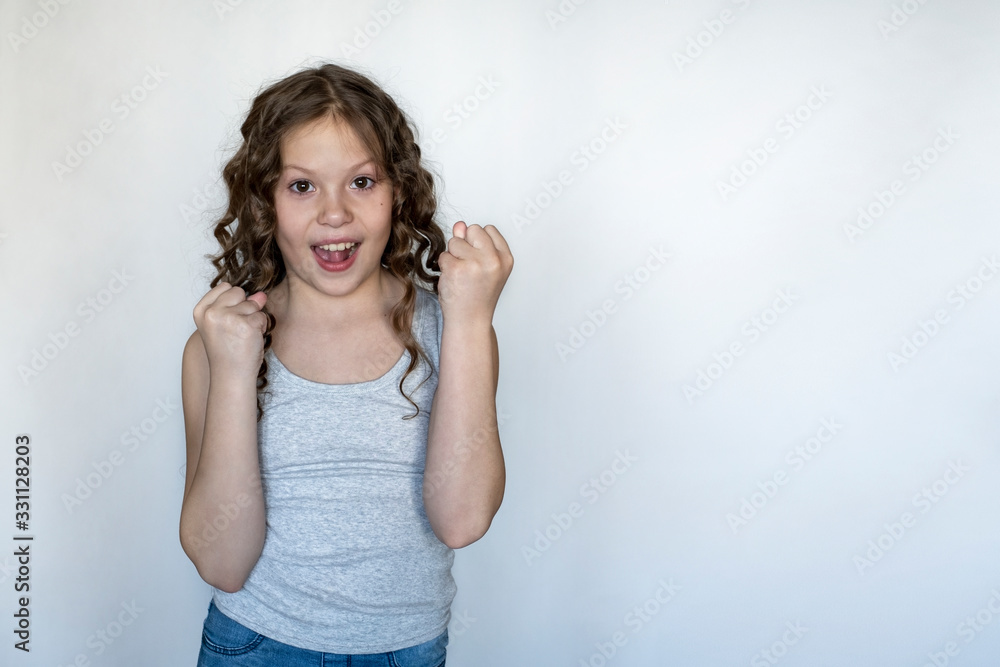 beautiful girl rejoices at something