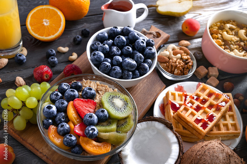 Concept of healthy diet. Breakfast with fruits, berries, granola.