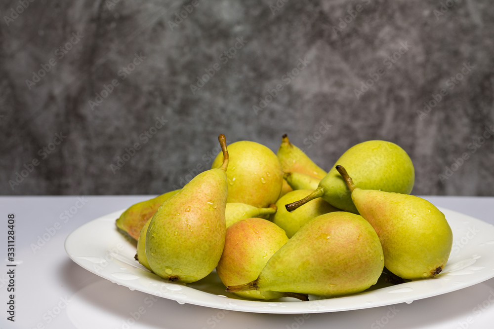Ripe and juicy pears on the table with drops of water. Ripe and juicy pears on the table with drops of water.