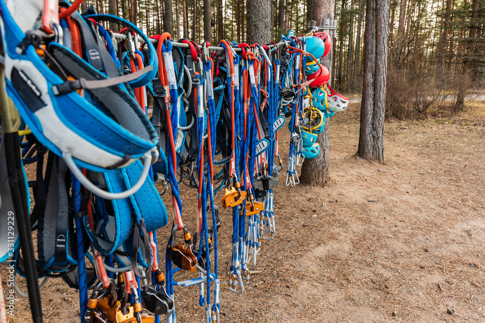 Climbing equipment: ropes with carabiners, safety belts, helmets.