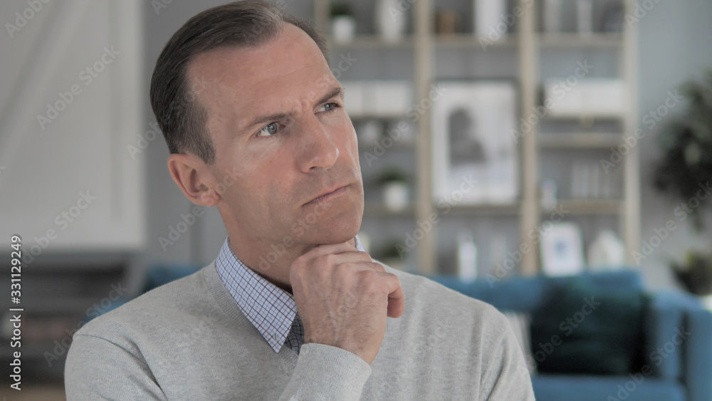 Pensive Middle Aged Man Thinking for New Idea Pensive Middle Aged Man Thinking for New Idea