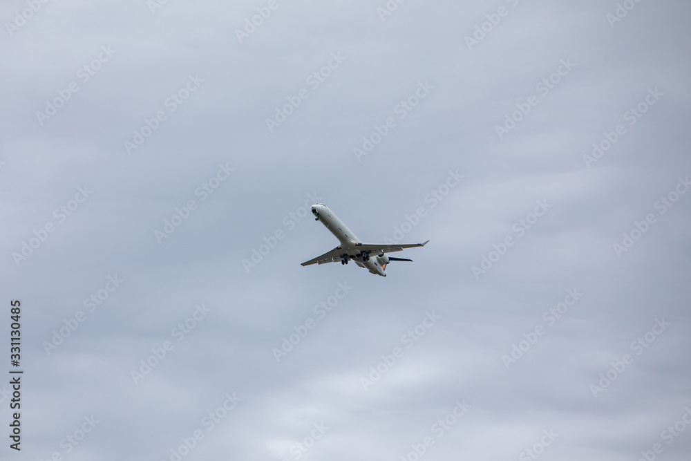 plane in sky landing overcast weather plane in sky landing overcast weather