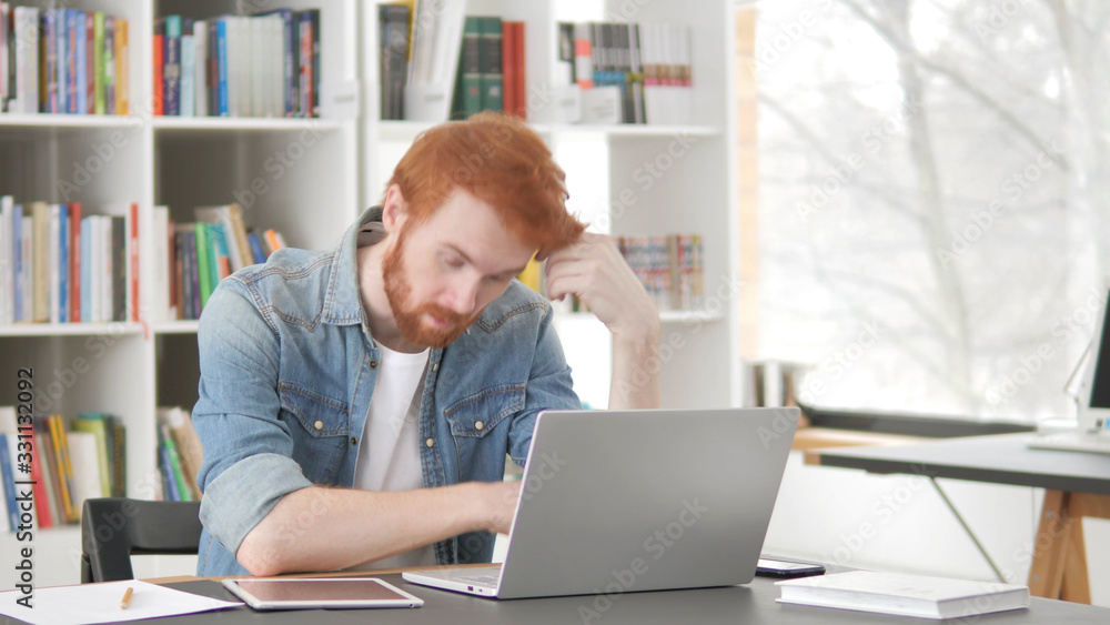 Tired Young Casual Redhead Man Sleeping at Work Tired Young Casual Redhead Man Sleeping at Work