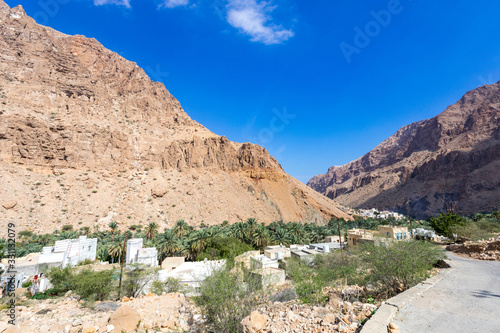 Typical Oman village surrounded by mountains at Wadi Tiwi - Oman