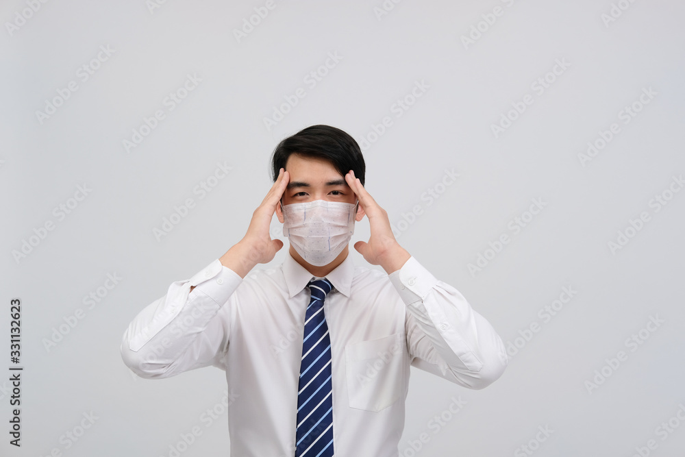 businessman man feeling sick, headache wearing protective mask against cold flu virus bacteria infection pollution