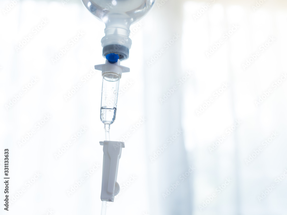 Saline drip medical,IV Drip Solution, Intravenous Treatment for Hospital Patients,coronavirus or covid-19 concept.soft focus. Saline drip medical,IV Drip Solution, Intravenous Treatment for Hospital Patients,coronavirus or covid-19 concept.soft focus.