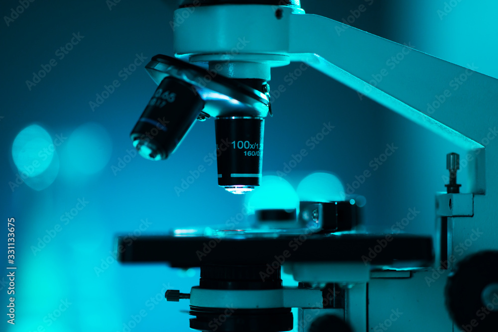Close-up of scientific microscope. Laboratory in hospital. Epidemic disease, healthcare, vaccine research and coronavirus 2019-ncov test. Close-up of scientific microscope. Laboratory in hospital. Epidemic disease, healthcare, vaccine research and coronavirus 2019-ncov test.