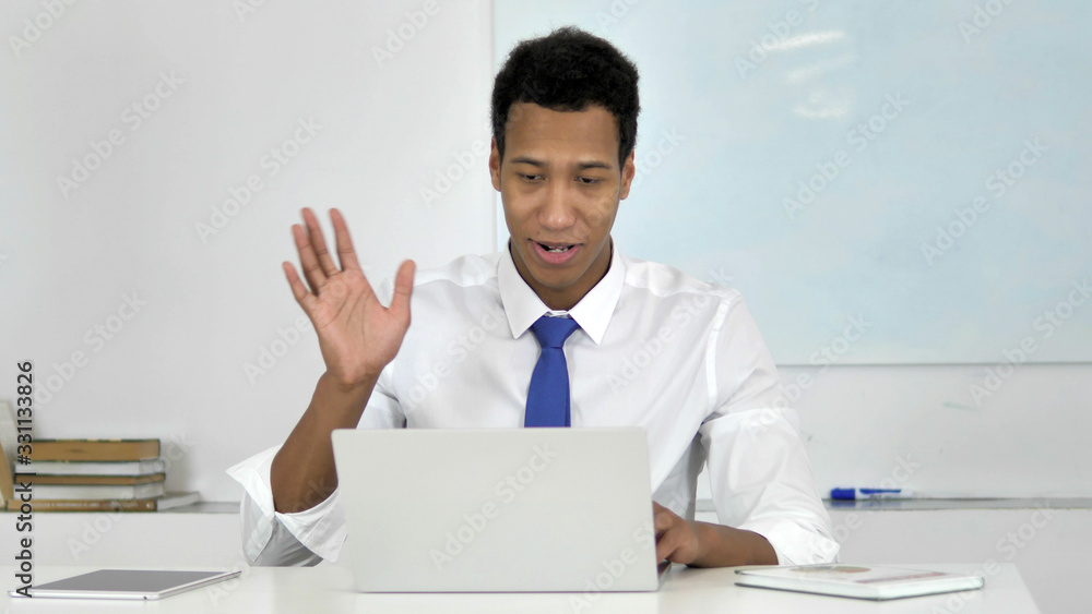 Online Video Chat by Afro-American Businessman at Work Online Video Chat by Afro-American Businessman at Work