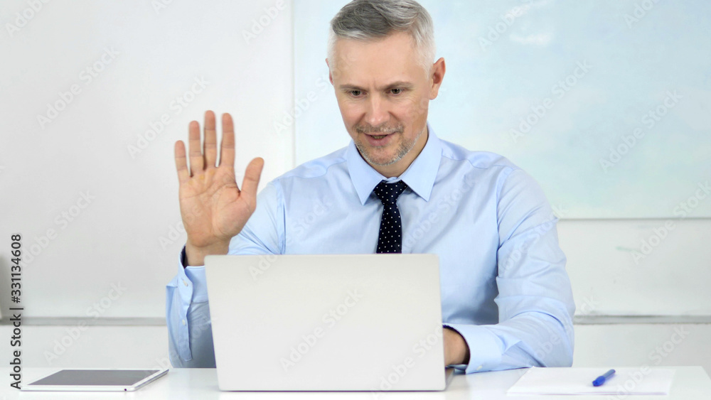Online Video Chat by Senior Businessman at Work Online Video Chat by Senior Businessman at Work