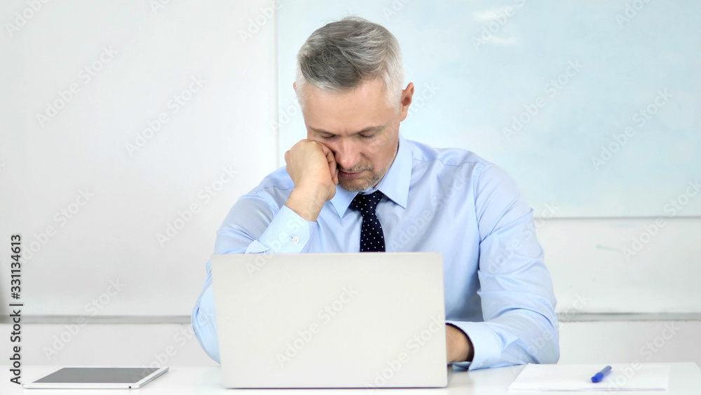 Naklejka premium Senior Businessman Sleeping at Work